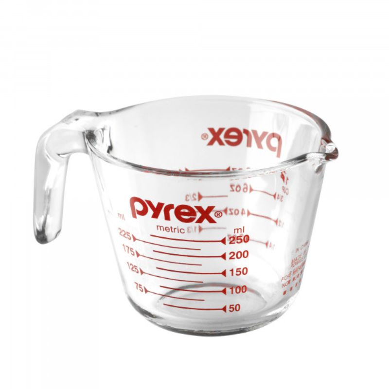 Clear Pyrex 1 Cup Measuring Jug (250ml) with easy-to-read markings and ergonomic handle for precise pouring.