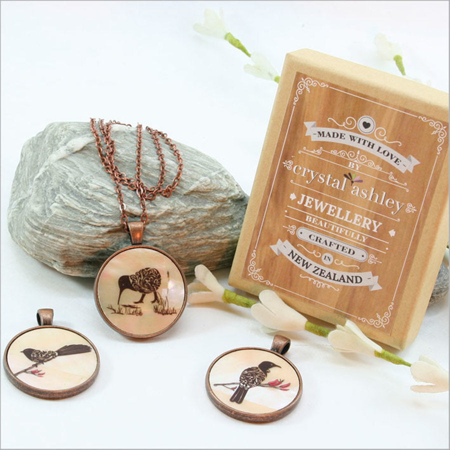 Elegant Circle Pendant Necklace featuring a Filigree Tui design on mother of pearl, with a 30mm pendant and 75cm chain.