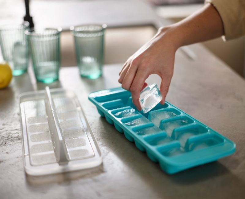 Joseph Joseph Flow Easy-fill Ice-cube Tray with linked cavities for easy filling, 14 large cubes, and a stackable lid.