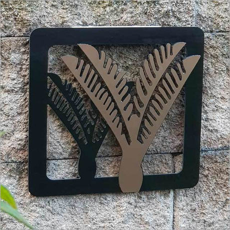 Two-tone Nikau Art Panels featuring brushed copper and black design, perfect for indoor or outdoor décor.