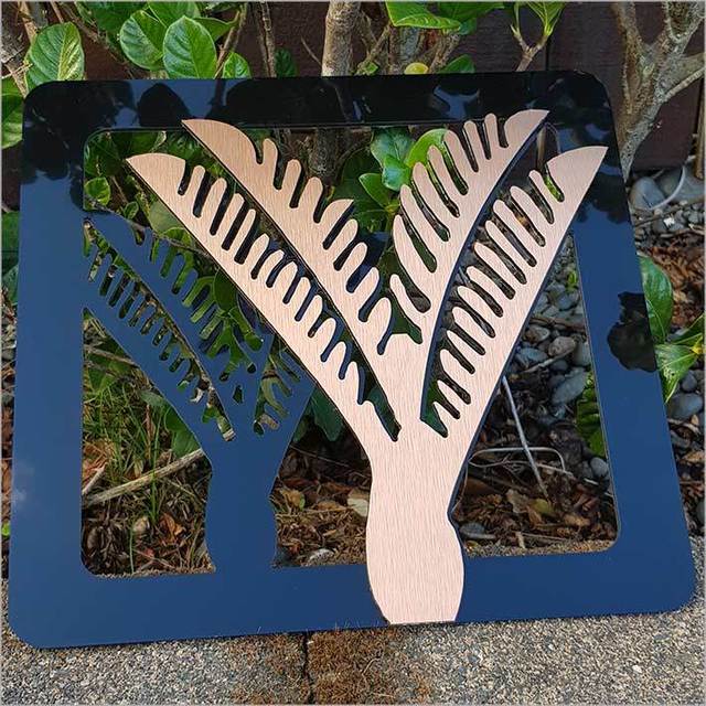 Two-tone Nikau art panels in brushed copper and black, perfect for enhancing home decor with Kiwiana inspiration.