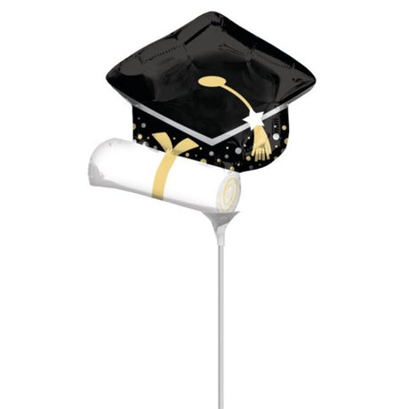 Mini black graduation cap with white diploma, perfect for celebrating academic achievements and enhancing party decor.