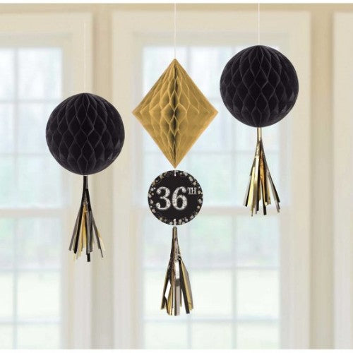 Vibrant honeycomb hanging decorations for any age, featuring tissue and foil tassels, perfect for festive celebrations.