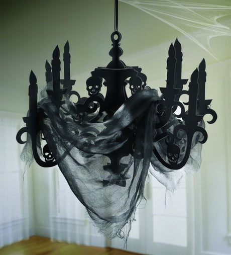 Haunted Mansion candelabra and gauze decoration, perfect for Halloween with an eerie ambiance and ghostly accents.