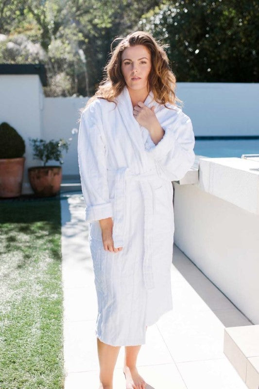 Luxury white bathrobe with shawl collar, pockets, and stripe detailing, made from OEKO-TEX® certified cotton.