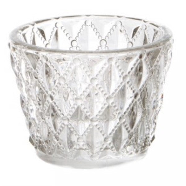 Elegant glass candle holder with diamond pattern, perfect for creating warm ambiance with tea lights or small candles.