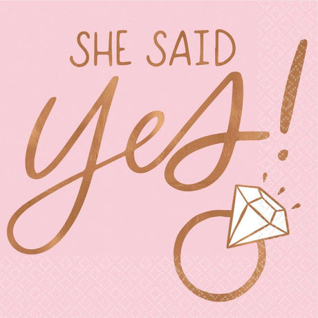 Blush beverage napkins with 'She Said Yes' in gold, perfect for weddings and engagements, pack of 16.