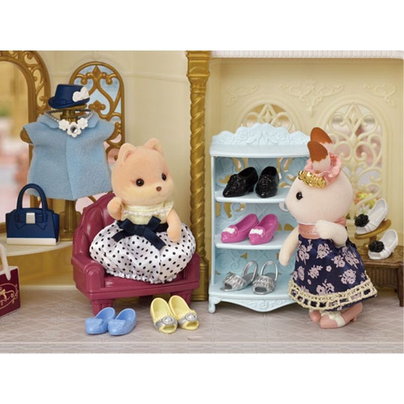 Sylvanian Families Shoe Shop Playset featuring Melanie Caramel with stylish shoes, display stand, and accessories for imaginative play.