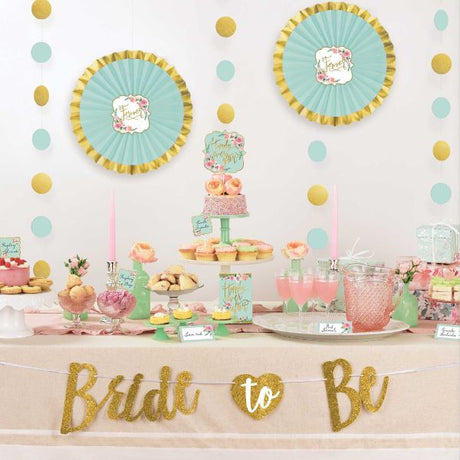 Mint To Be Buffet Table Decorating Kit featuring tent cards, picks, glitter banner, and hanging decorations for vibrant celebrations.