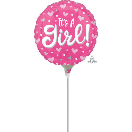 Heart and dot patterned foil balloon reading 'It's A Girl', perfect for celebrations like baby showers and gender reveals.
