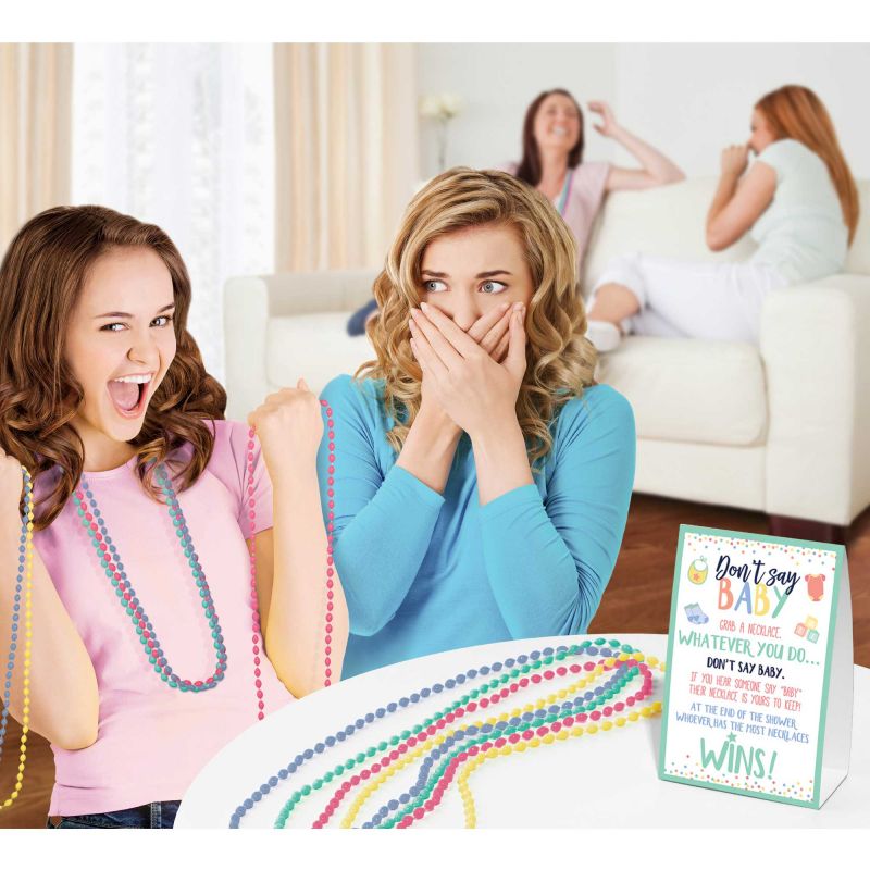 Colorful beaded necklaces and tent card for the Baby Shower Don't Say Baby Game, perfect for lively gatherings.
