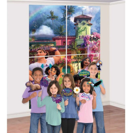 Colorful Encanto Scene Setter with 4 large backdrops and 12 fun photo props for vibrant themed parties.