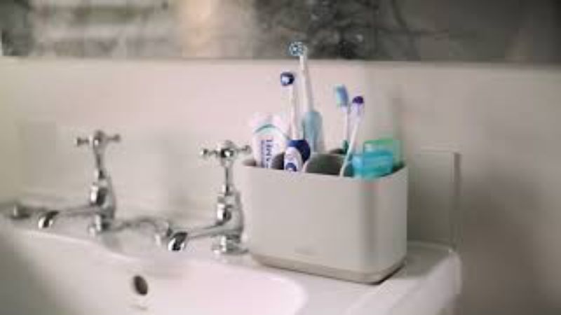 Joseph Joseph EasyStore Large Toothbrush Caddy in Ecru with compartments for toothbrushes, toothpaste, and floss.