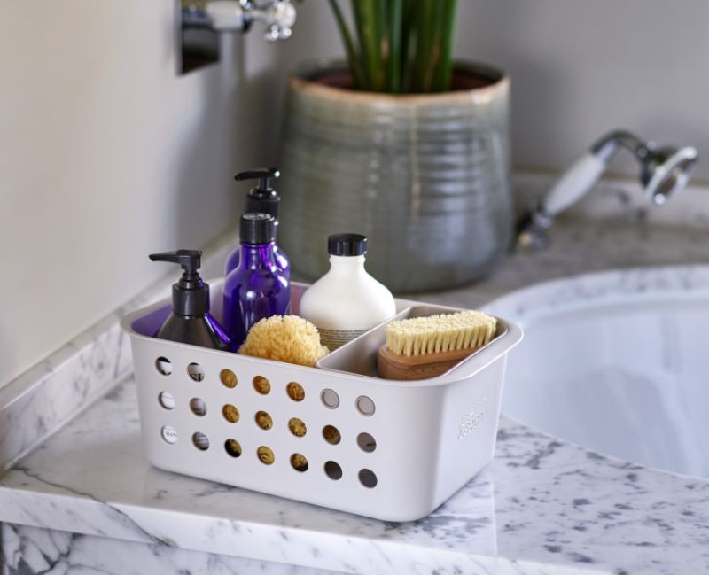 Joseph Joseph EasyStore Bathroom Storage Basket for organizing grooming essentials with deep ventilated sides and moveable tray.