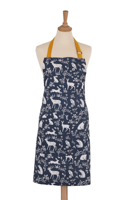 Navy cotton apron featuring whimsical woodland animals, adjustable straps, and eco-friendly fabric for charming kitchen use.
