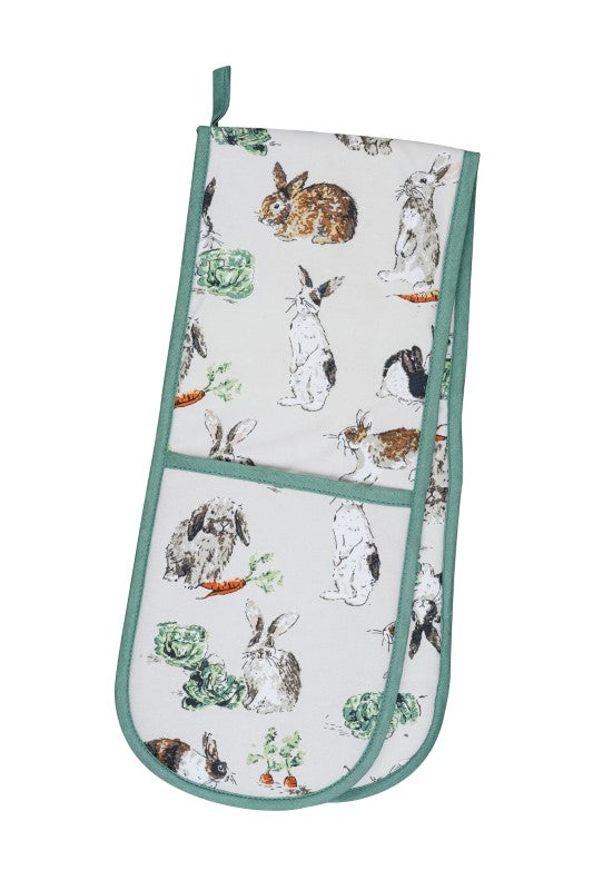 Charming Ulster Weavers Double Oven Glove featuring playful rabbits on a soft parchment background, eco-friendly and durable.