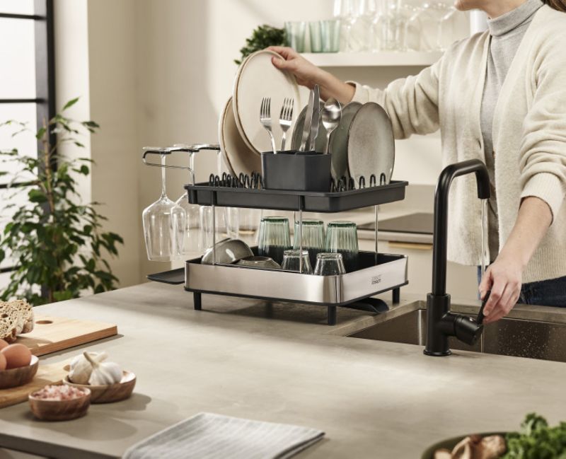 Joseph Joseph Steel 2-Tier Dish Rack for efficient drainage, holding up to four place settings and tall wine glasses.