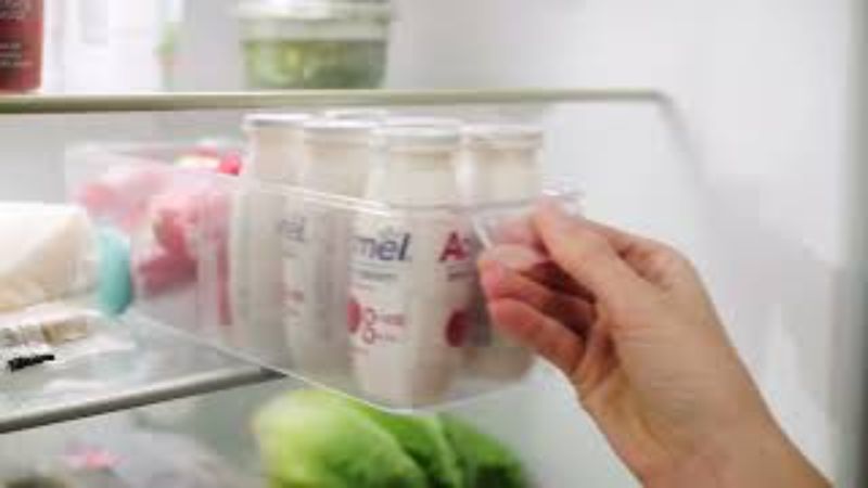 Joseph Joseph FridgeStore Small Storage: Compact fridge drawer organizer with easy-pull handle and customizable divider.