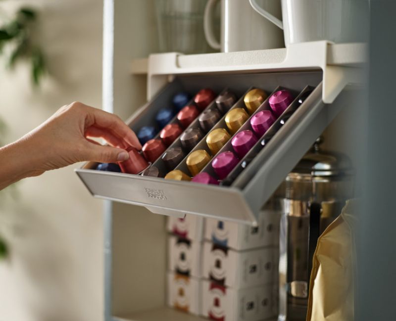 Joseph Joseph CupboardStore Coffee Pod Drawer, designed to hold 30 Nespresso capsules under a shelf, maximizing space and organization.