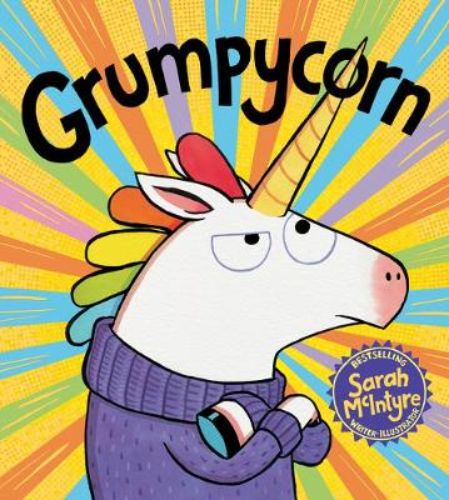 Vibrant hardback picture book 'Grumpycorn' featuring a unicorn struggling with writer's block and celebrating creativity.