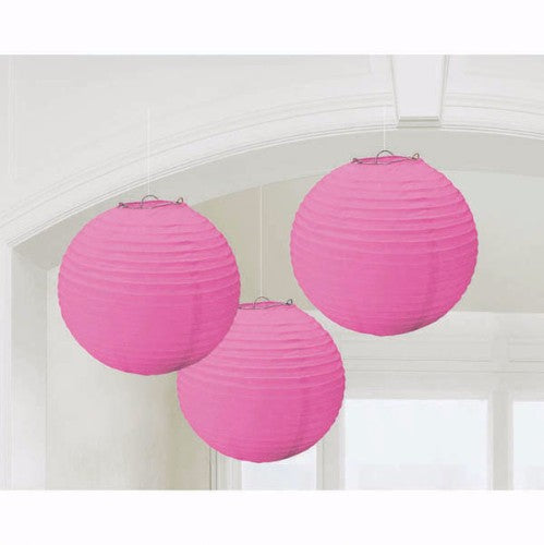 Vibrant pink round paper lanterns, 24cm, pack of 3, perfect for decorative ambiance at parties and events.