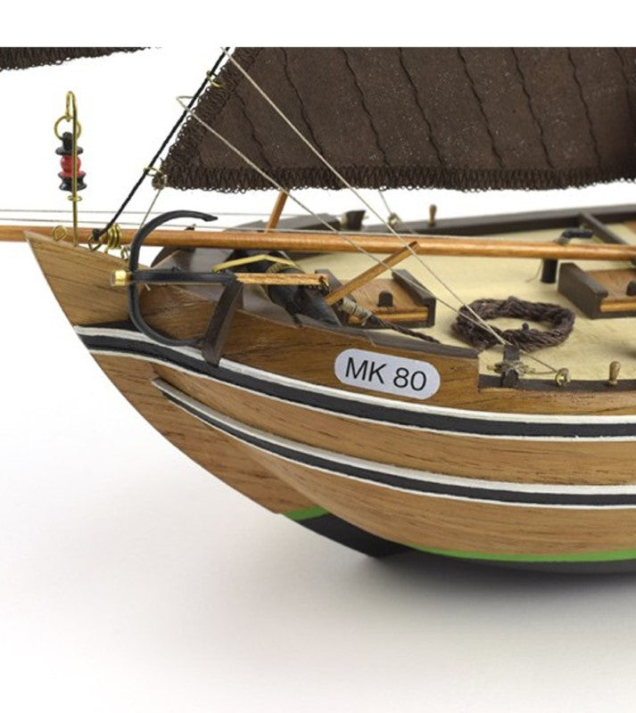 1/35 scale wooden model kit of the Botter fishing boat, featuring precision parts and hand-sewn sails, perfect for hobbyists.