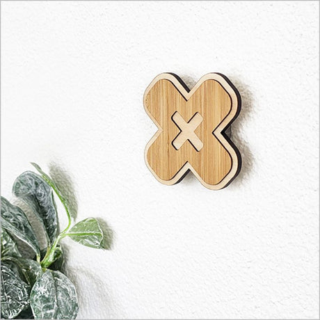 Elegant 6.5cm bamboo hook in cross shape, eco-friendly and sturdy for organizing clothing, towels, and bags.