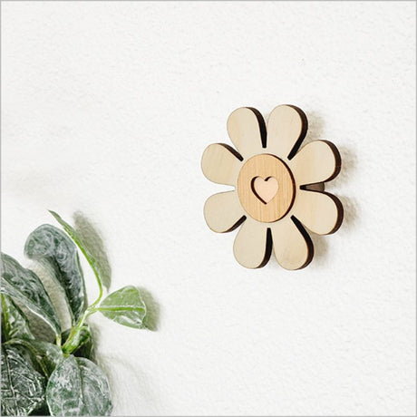 Eco-friendly 6.5cm bamboo wall hook in daisy design, perfect for organizing clothes and towels, arrives in a gift box.