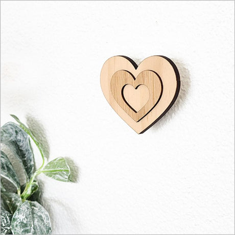 Heart-shaped bamboo wall hook, 6.5 cm, eco-friendly design for kids' rooms and practical storage solutions.