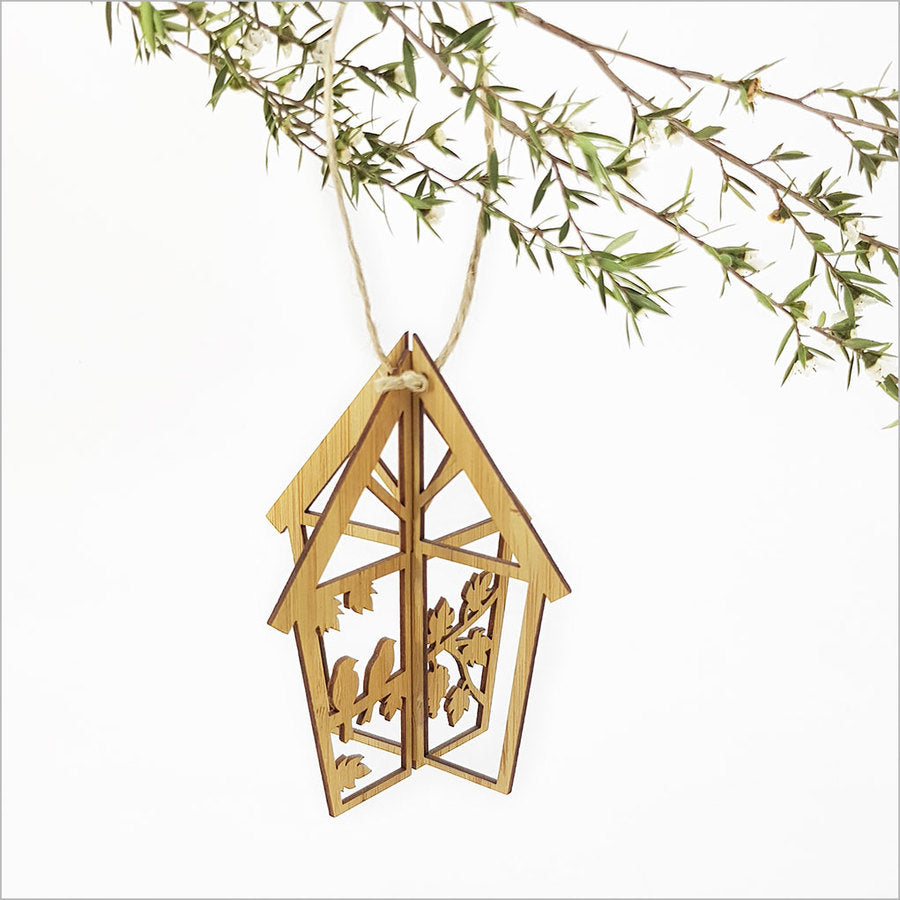 Charming eco-friendly bamboo birdhouse ornament, perfect for garden decor and attracting birds, handcrafted with intricate details.