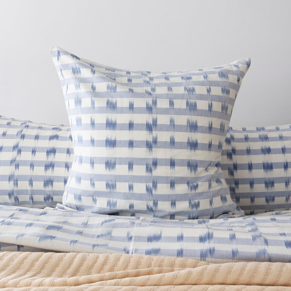 Luxurious Amara European Pillowcase in celestial blue and ivory, crafted from 100% cotton with ikat weaving, 65x65cm.