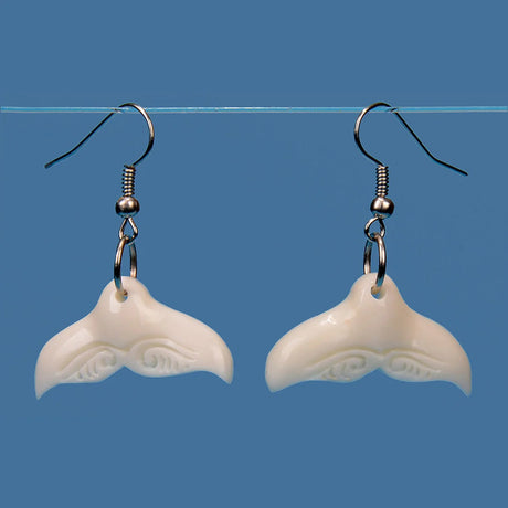 Handcrafted Bone Whale Tail Earrings showcasing Kiwiana artistry, embodying New Zealand's culture and marine life.