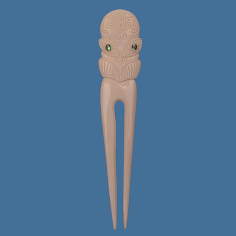 Tiki Face Small Heru: a beautifully carved ornamental comb reflecting M?ori heritage, perfect for stylish hair grooming.