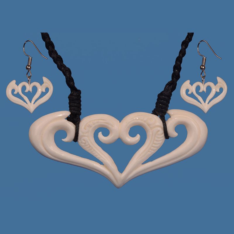 Handcrafted Bone Koru Necklace and Earring Set, symbolizing growth and nature with adjustable cord and timeless design.