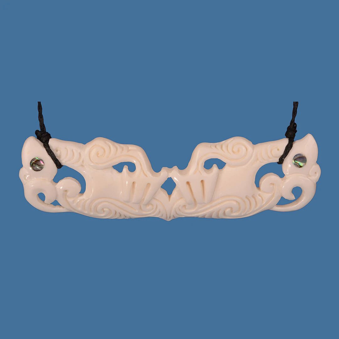 Handcrafted Bone Double Manaia Necklace featuring the Manaia symbol, symbolizing balance and protection with a braided cord.