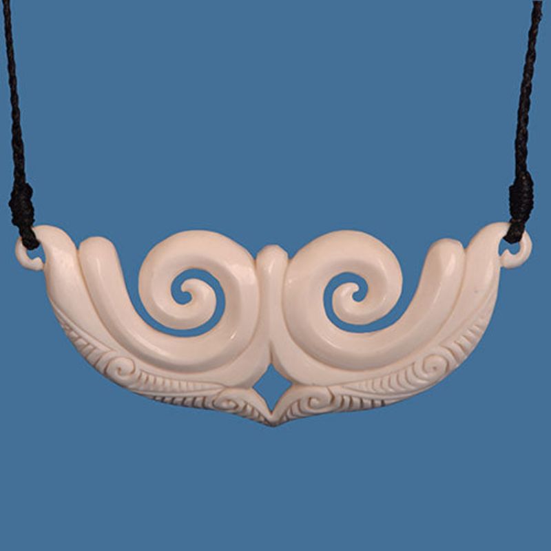 Double koru breastplate
