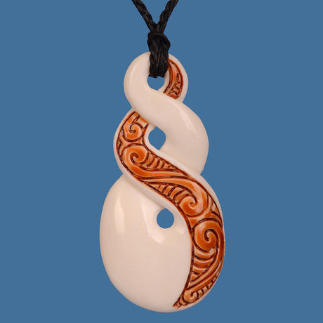 Bone Double Twist pendant in stained beef bone, showcasing Maori craftsmanship and symbolizing life's interconnectedness.