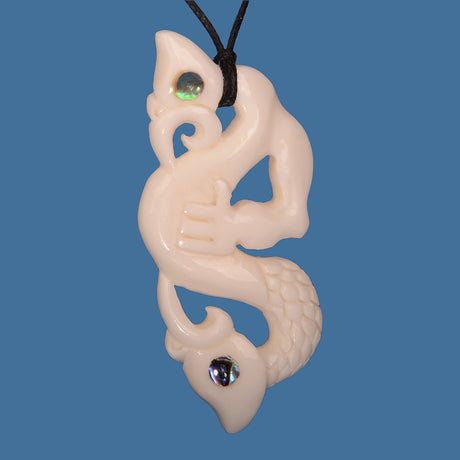 Hand-carved Bone Double Manaia Pendant symbolizing duality and protection, on adjustable black wax cord.