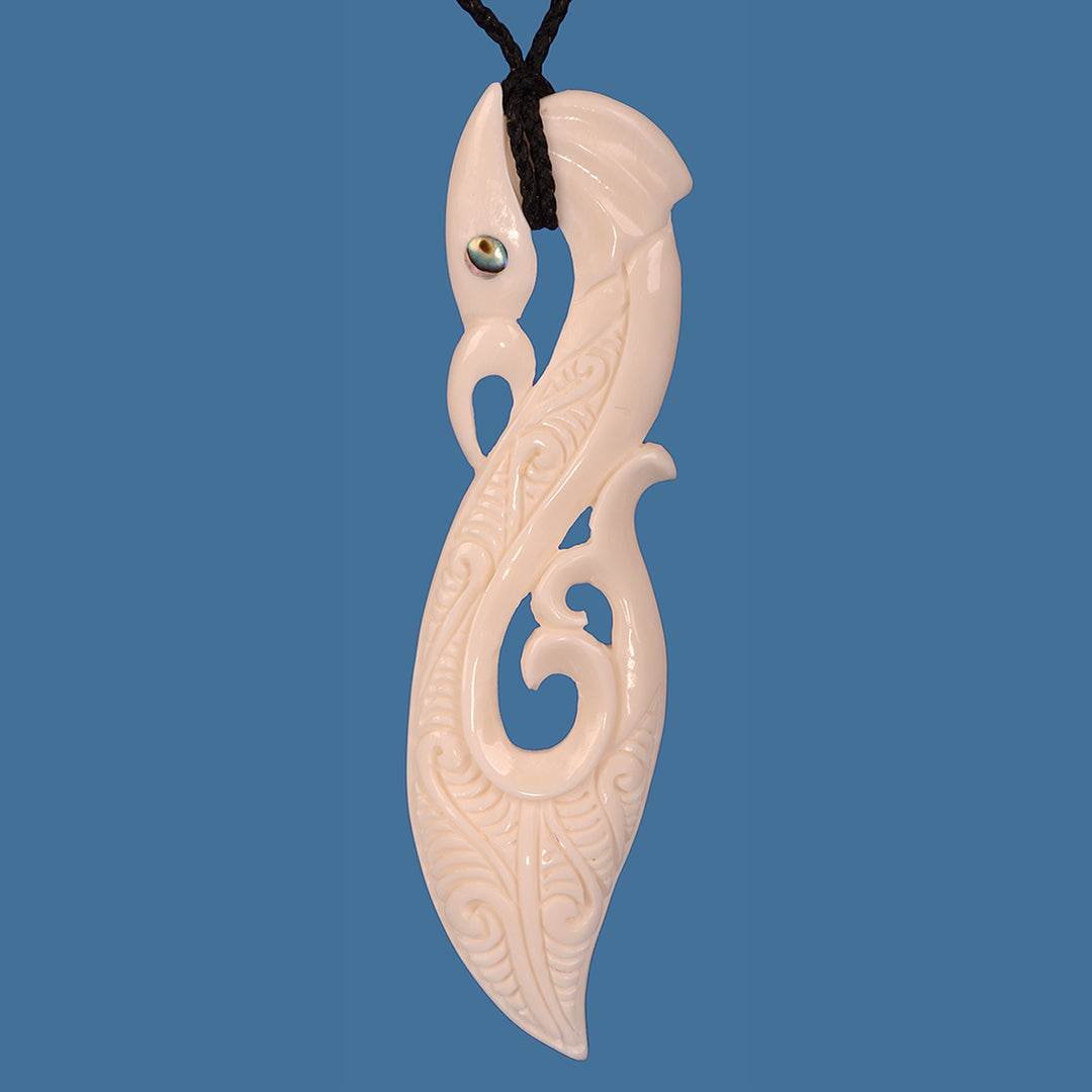 Bone Manaia Extra Large Pendant: Hand-carved Maori symbol of protection, measuring 34mm wide and 135mm high, on adjustable cord.