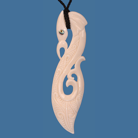 Bone Manaia Extra Large Pendant: Hand-carved Maori symbol of protection, measuring 34mm wide and 135mm high, on adjustable cord.