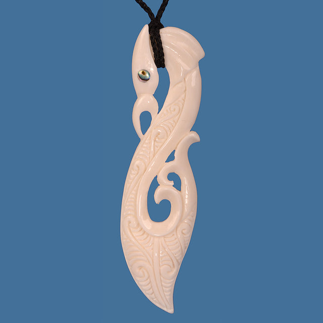 Bone Manaia Extra Large Pendant: Hand-carved Maori symbol of protection, measuring 34mm wide and 135mm high, on adjustable cord.