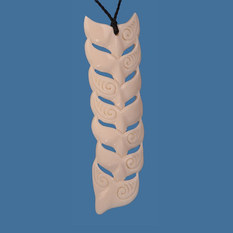 XL Bone Whale Tail pendant, 40mm x 135mm, crafted from bone, features unique carvings reflecting Maori heritage and ocean beauty.
