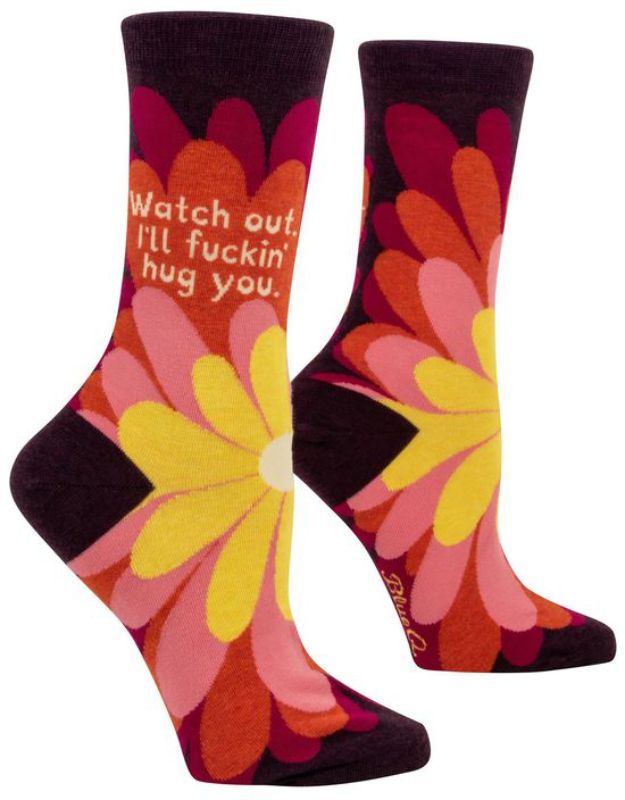 Whimsical Blue Q socks featuring 'I'll Fuckin Hug You' message, perfect for women’s shoe sizes 5-10, blend of comfort and humor.
