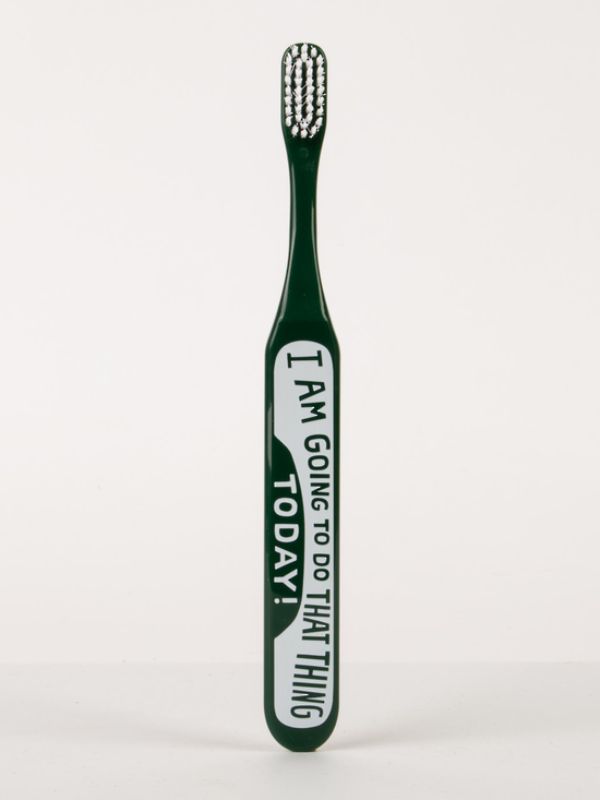 Blue Q Toothbrush with soft bristles and a wide handle, featuring an uplifting design for a cheerful brushing experience.