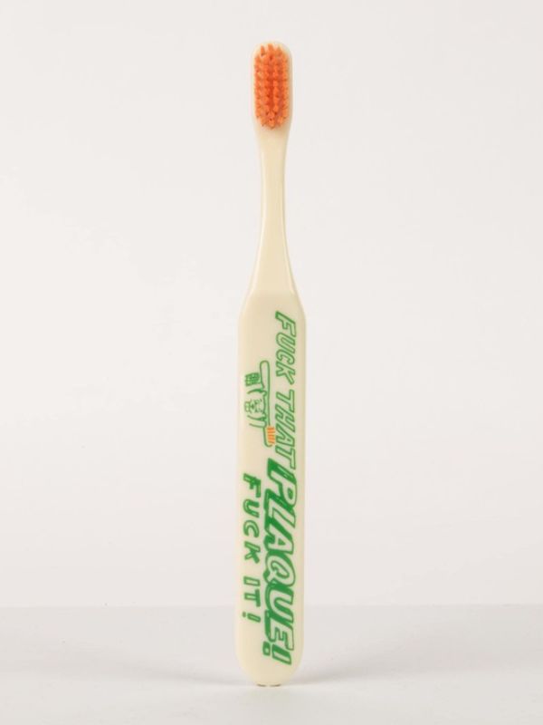Vibrant Blue Q toothbrush with soft bristles and wide handle, featuring the phrase 'Fuck That Plaque' for stylish, effective brushing.