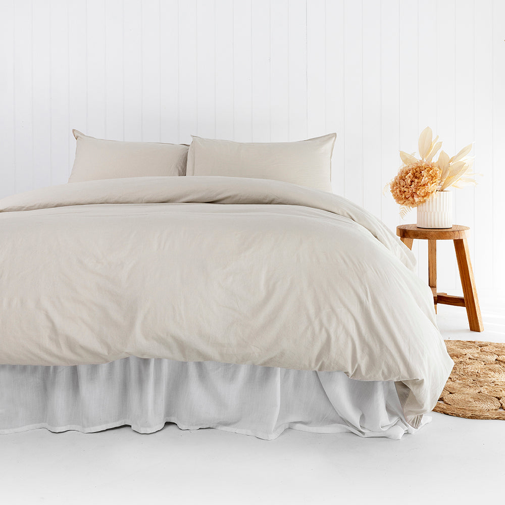 Queen duvet cover set in pebble, made of 100% organic cotton, featuring vintage-washed softness and elegant twin needle stitching.