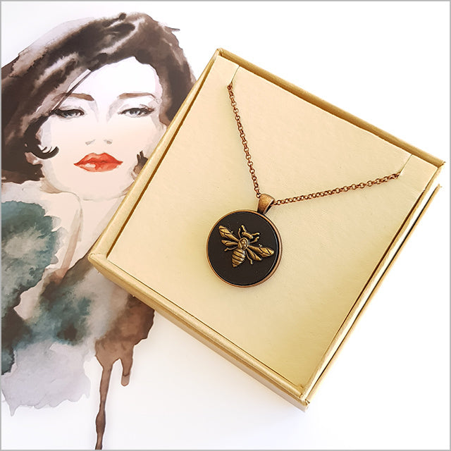 Vintage Honey Bee Circle Necklace featuring a black acrylic pendant with antique copper finish on a 75cm chain.