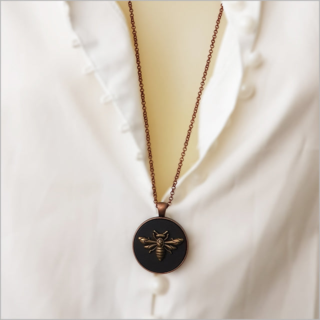 Vintage Honey Bee circle necklace with black acrylic pendant and antique copper finish, on 75cm chain, elegantly packaged.