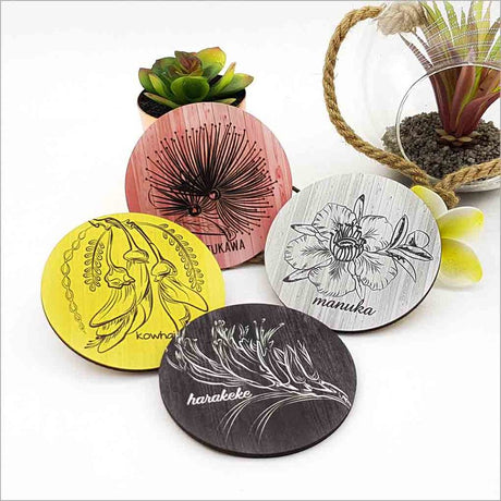 Set of Kiwiana coasters featuring New Zealand native flower designs, perfect for home decor and protecting surfaces.