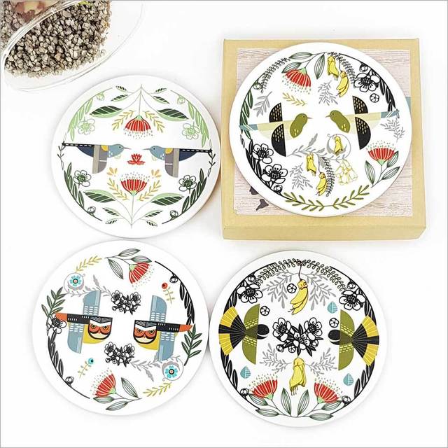 Colorful folk bird designs on rustic coasters, 100mm MDF with cork base, perfect for protecting surfaces and enhancing decor.